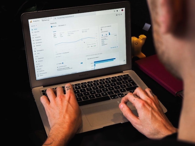 Person using Google Analytics on a laptop