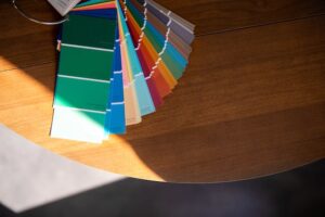 Stack of color swatches spread out on table