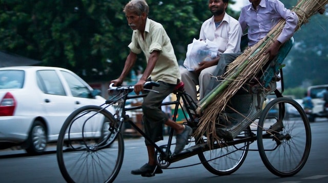 Understanding Business Taxation Men on Rickshaw