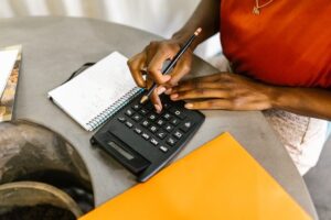 Woman adding figures with a calculator