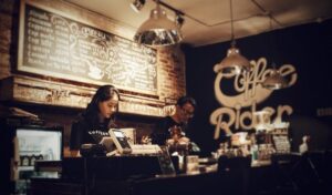 Workers behind the counter of a tea shop