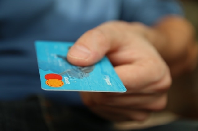 Working Capital Loan Man Holding Debit Card