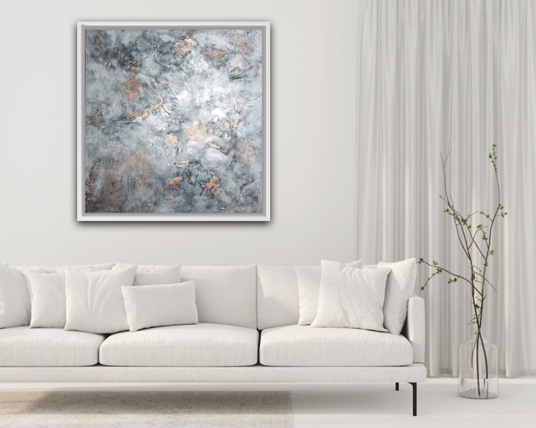 A beautiful painting by Nicole Barbara Arts hangs on the wall of a modern living room