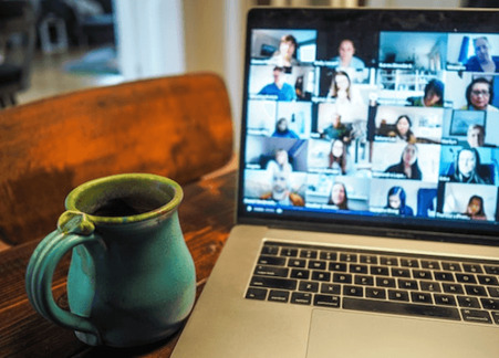 A coffee cup by a video call