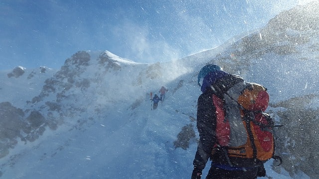 Digital snowmads climbing a snowy mountain