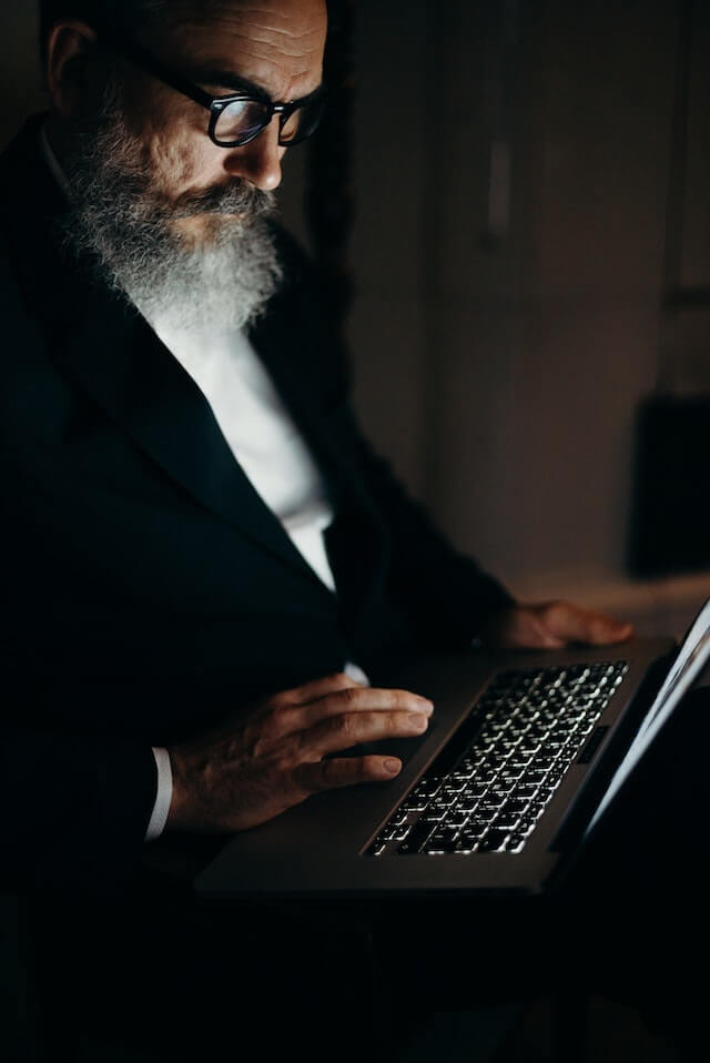 Man reading email on a laptop