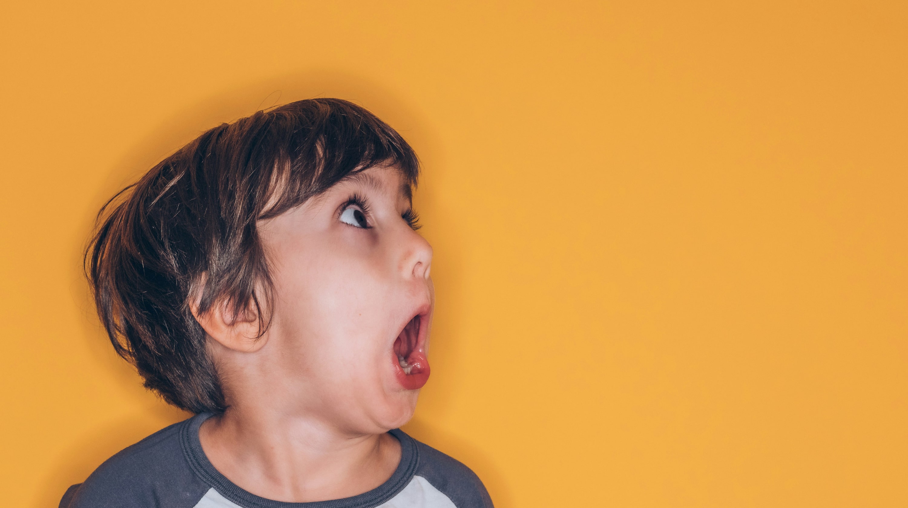 Small boy with a suprised look on his face