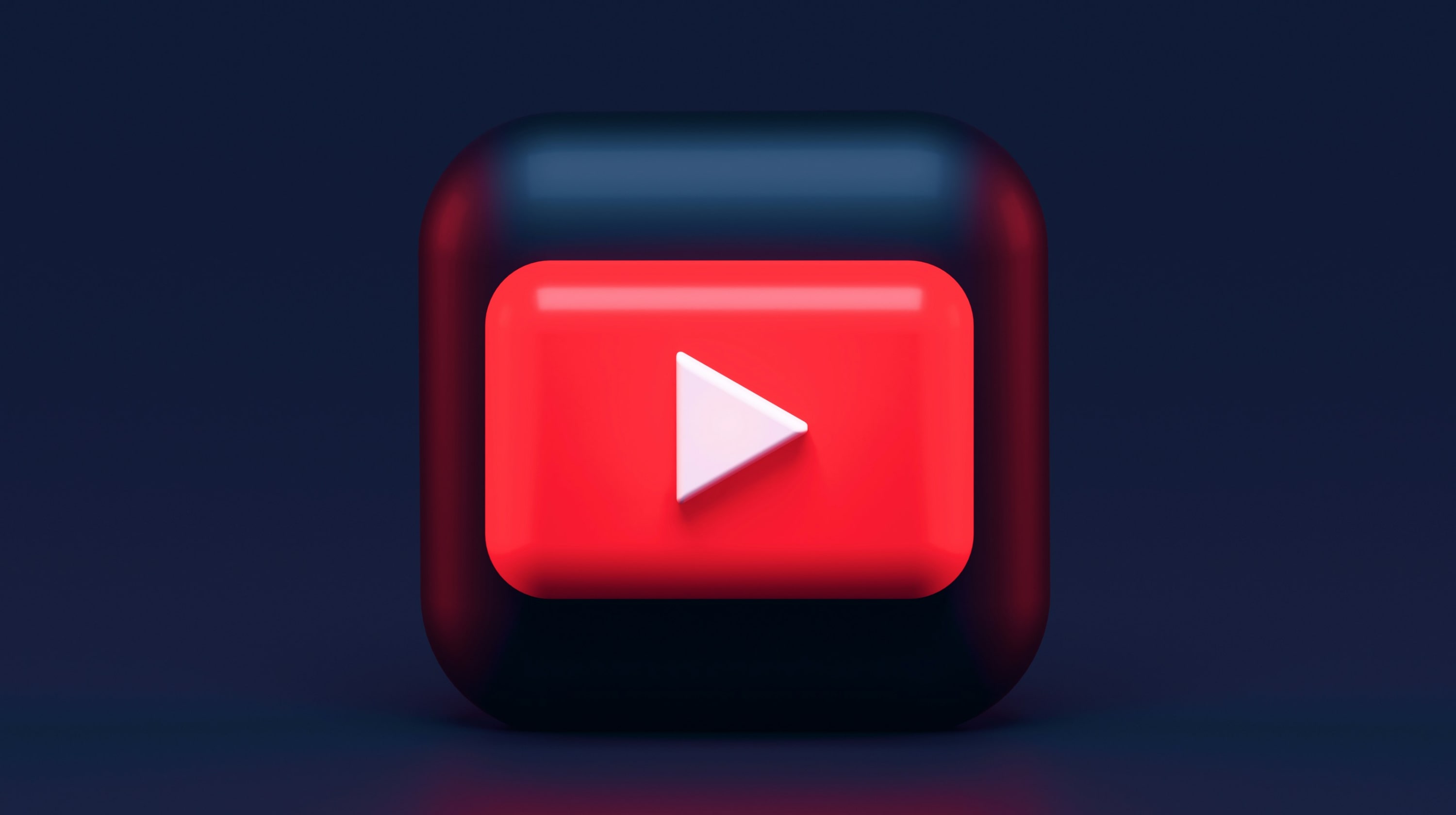 Closeup of red YouTube play button with white arrow