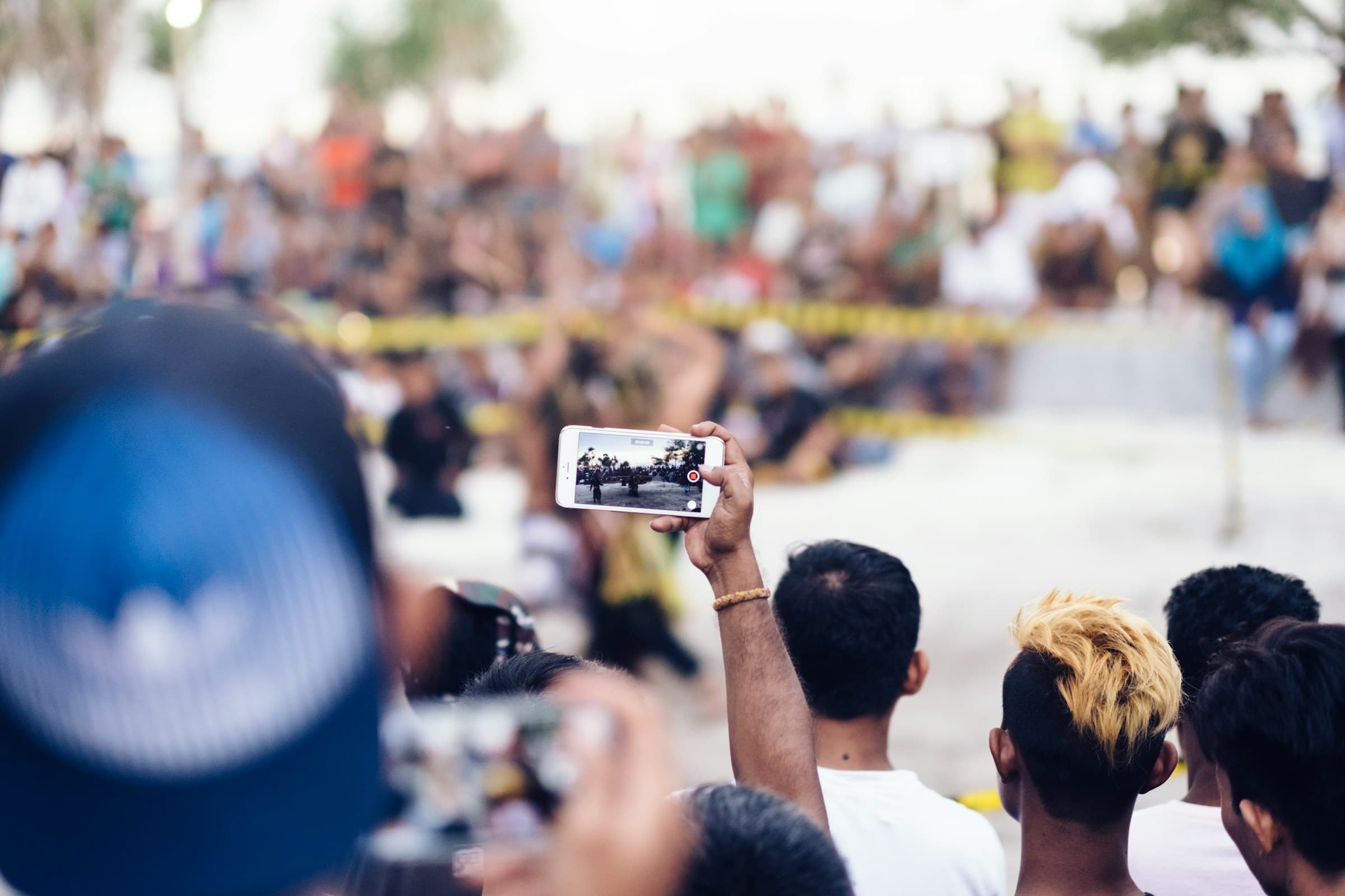 Person taking an outdoor video with his phone