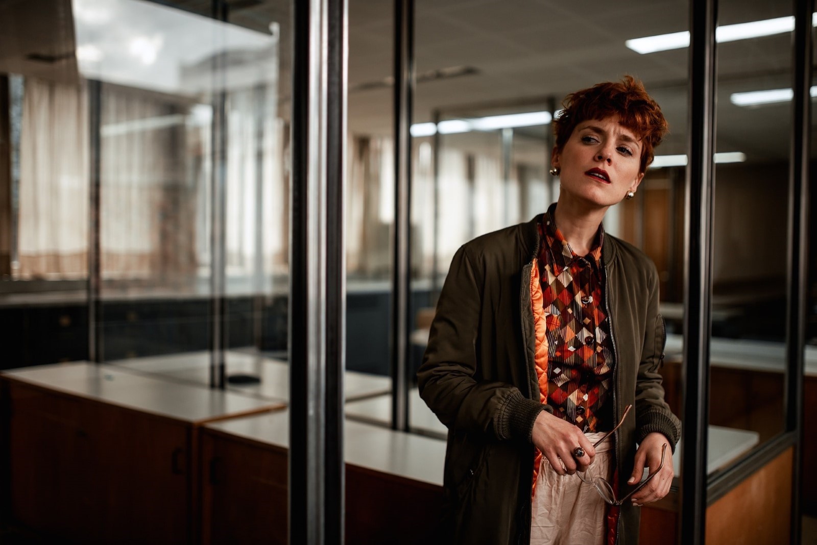 Female boss standing outside a business conference room