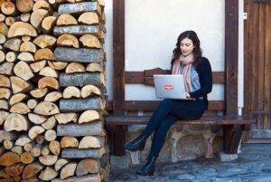 Woman working on a laptop outdoors