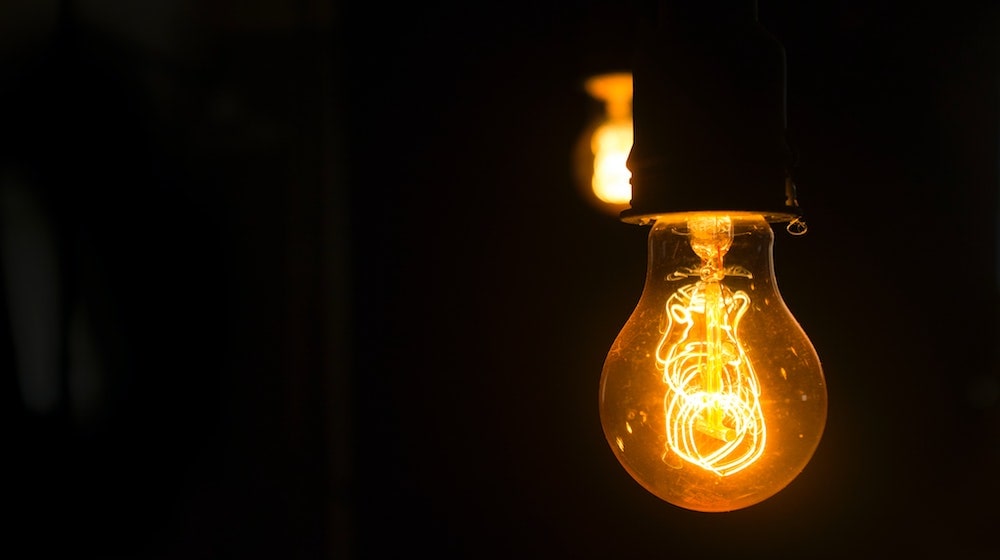 Old fashion style lightbulb on black background