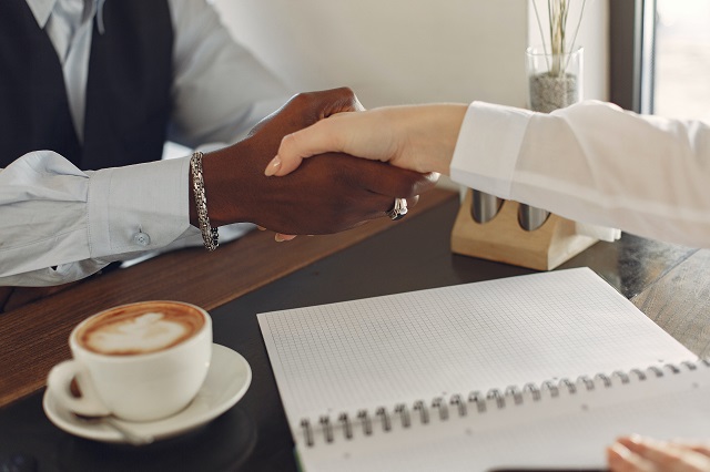 Man and woman shaking hands