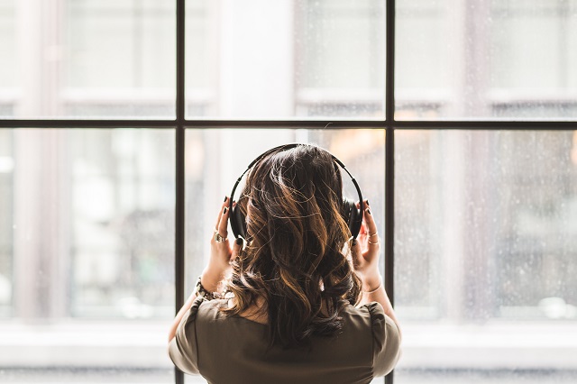 Woman listening to headphones