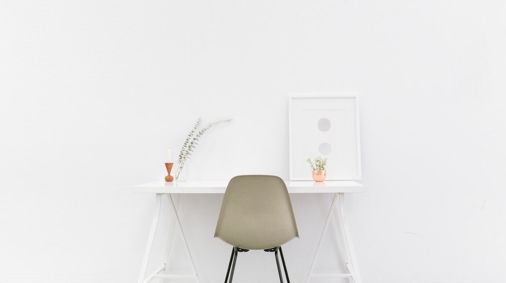 Simple desk and chair on white background