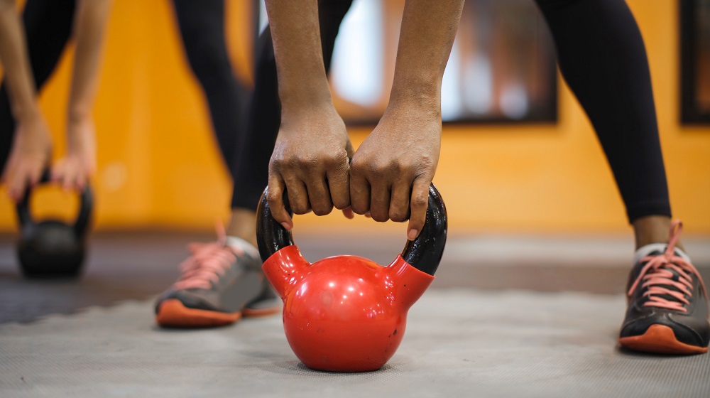 Person holding a kettlebell during workout