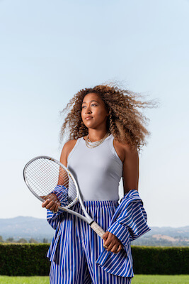 Naomi Osaka with tennis racket]