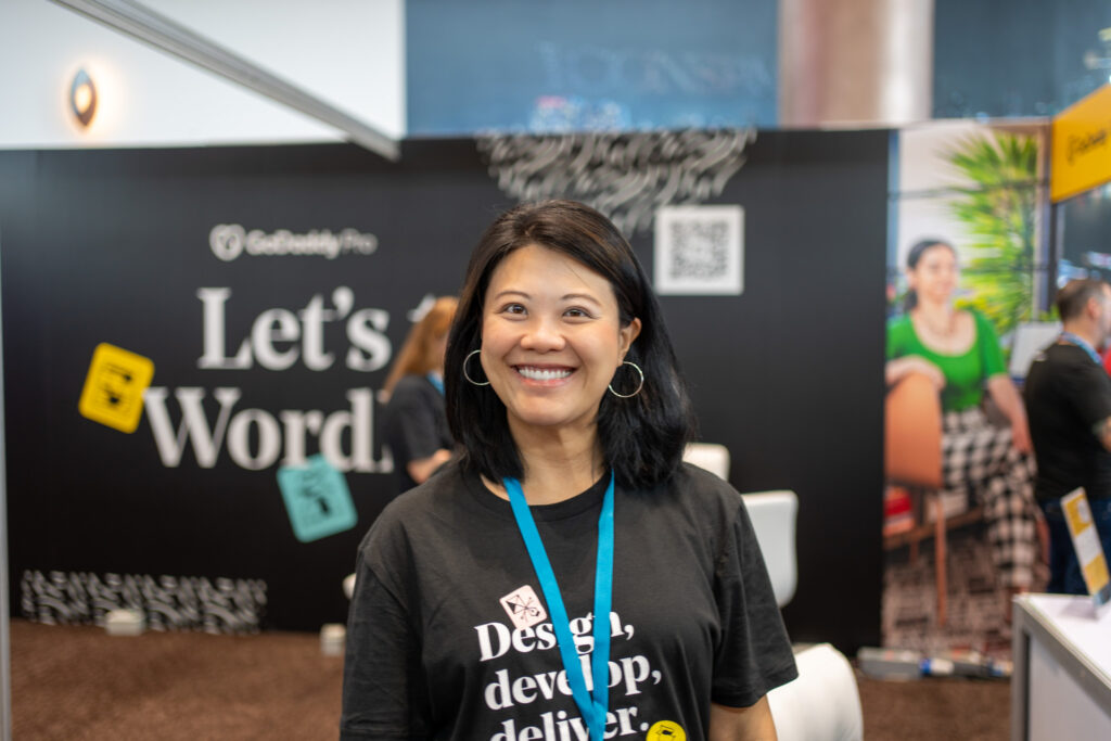 Nikki Williams at the GoDaddy Pro booth during WordCamp Asia