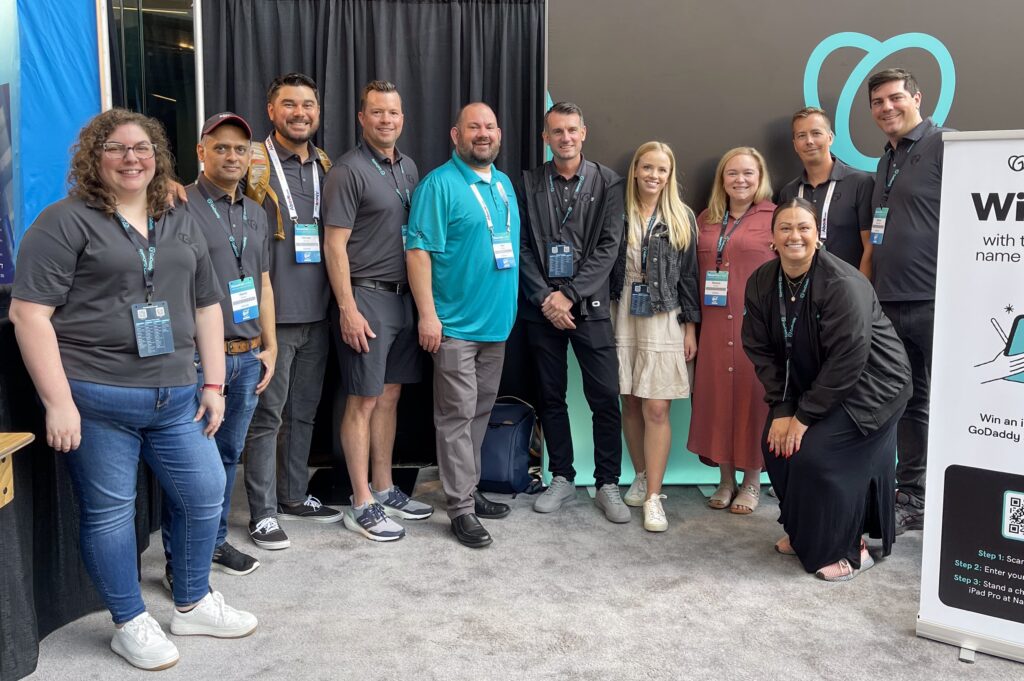 Group of GoDaddy domain team members posing for a group picture