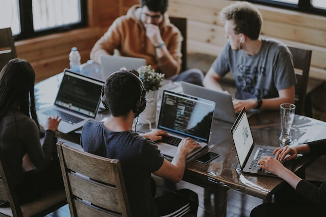 Business professionals gathered at a conference table(1)