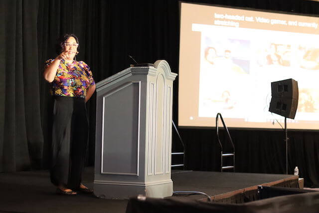 Courtney Patubo Kranzke giving speech on Learn WordPress at WCUS 2023