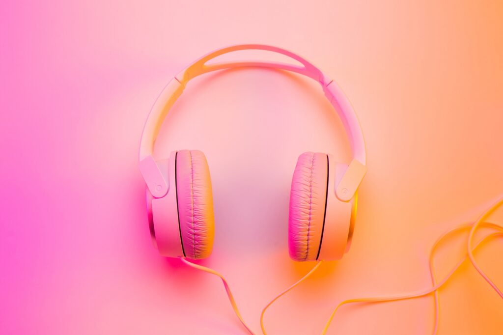 Headphones on colorful (multicolor tonal transitions) background. Poster layout with free text (copy) space.