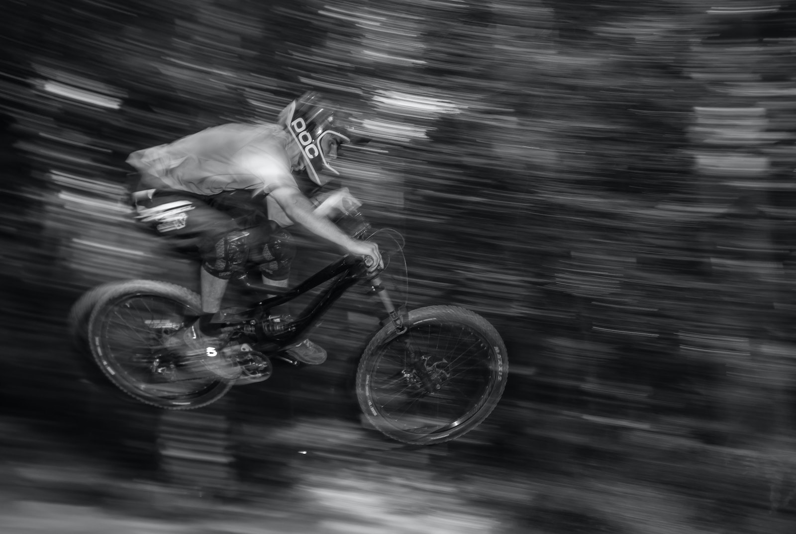 Someone on a mountain bike soaring through a jump