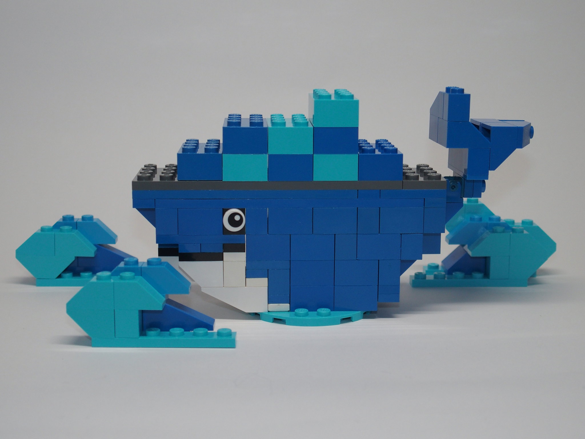 A blue and white building blocks forming a whale