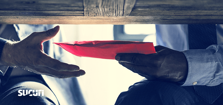 A person holding a red envelope