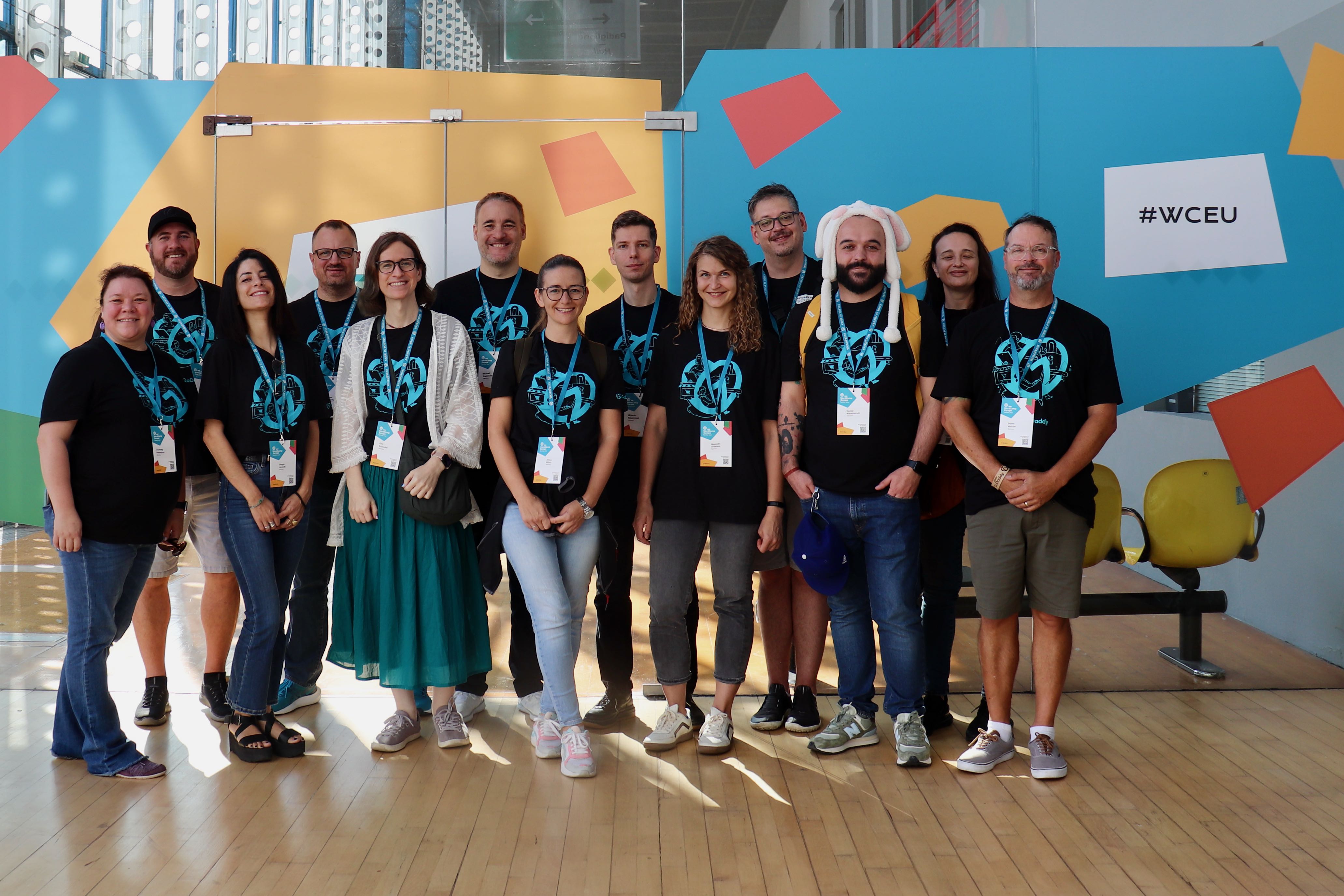 GoDaddy staff pause for a group photo before attending WordCamp Europe 2024 Contributor Day