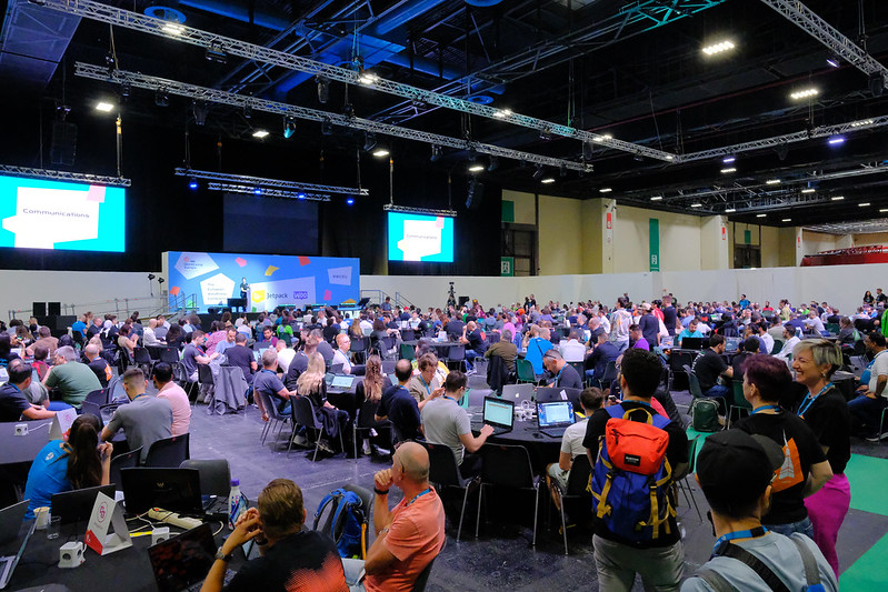 Wide shot of contributor day, showing many tables.