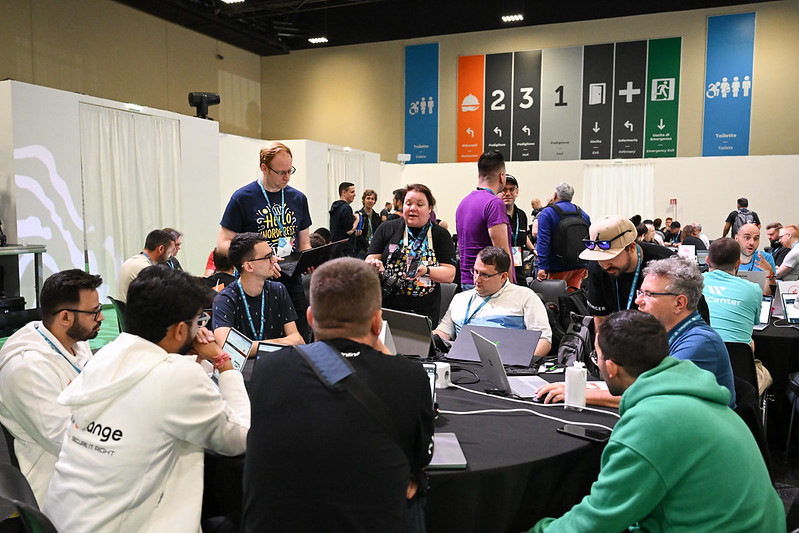 Courtney Robertson and Jono Alderson speak with the plugin review team table