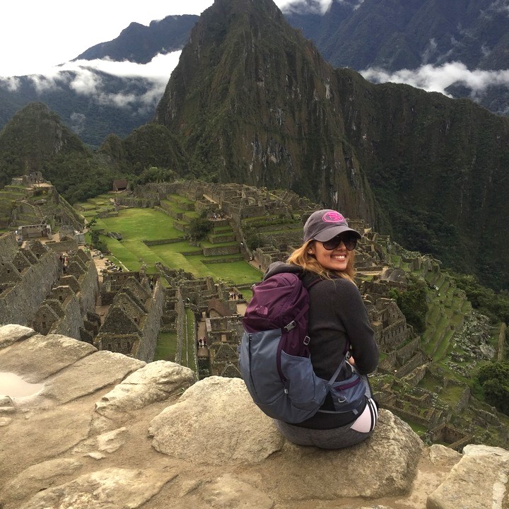 a person sitting on a rock