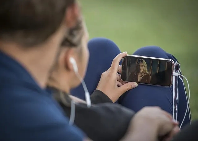 Do People Still Read Blogs- Woman Watching Video on Smartphone