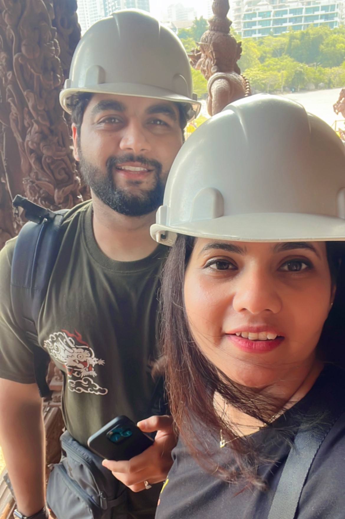 a man and woman wearing hard hats