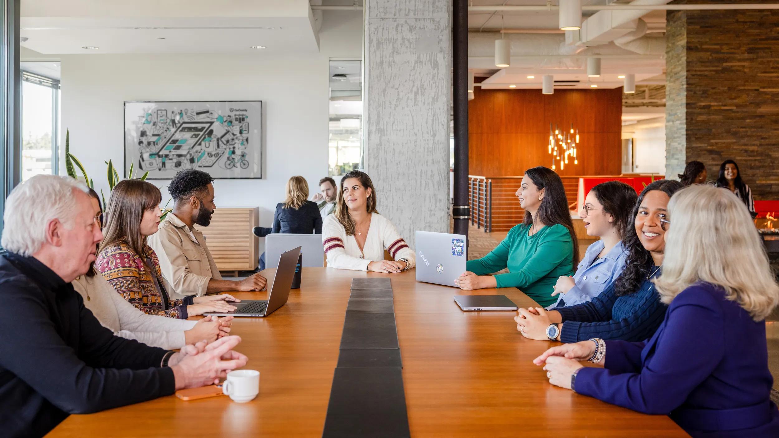 a group of people sitting around a table