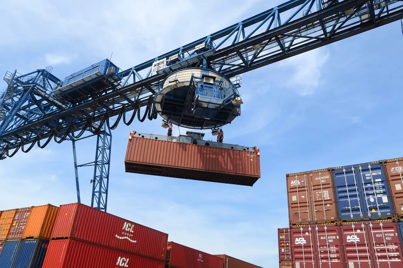 A Crane Moves a Shipping Container