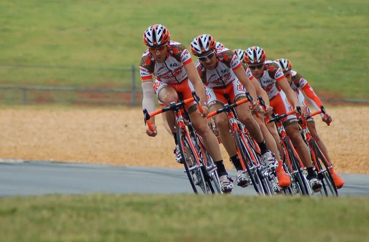 A Pack of Cyclists Compete in a Race