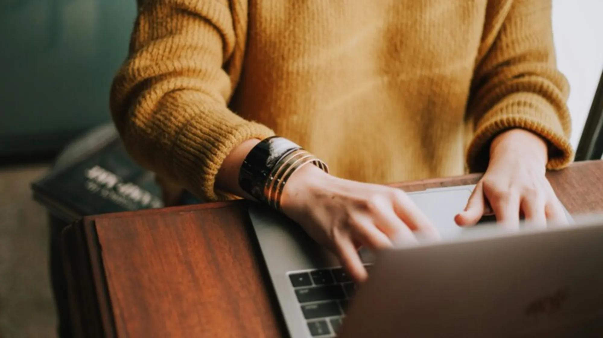 a person typing on a keyboard