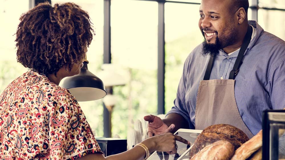 Business Referrals Bakery Owner With Smiling Customer