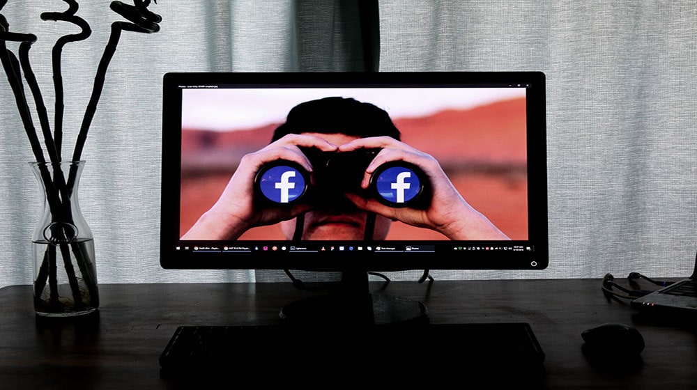 Man With Binoculars On Monitor