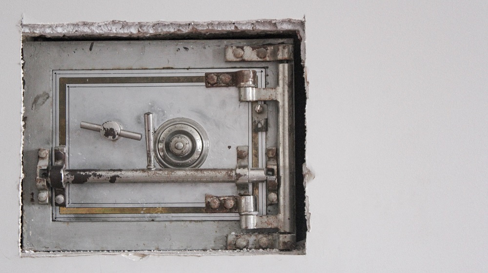 Locked Safe In A Wall Illustrating How To Legally Protect Your Business Name