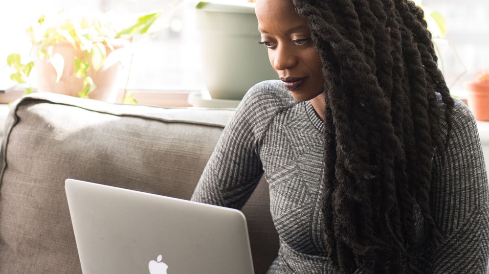 Woman Looking at Laptop Illustrates Venture Capital for Female Entrepreneurs